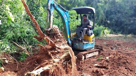 mini excavator digging stumps|tree stump removal with mini excavator.